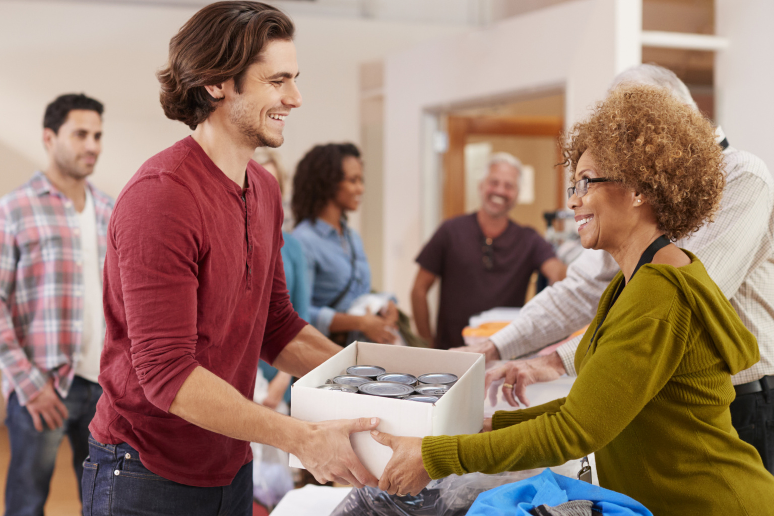 People Donating Food To Charity Food Bank Collection In Community ...